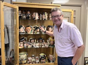 Auctioneer Richard Winterton with the jugs