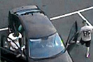 One of the men police are keen to trace in the car park captured on CCTV