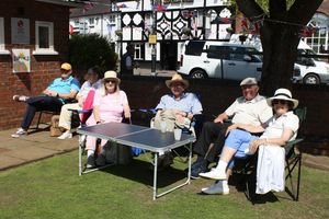 Members enjoying the sun and fellowship at a social event
