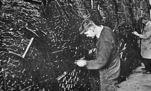 A giant cast iron mural depicting Shropshire industry through the ages. It is pictured at the Coalbrookdale Works. The mural was put in the entrance area of the new Shirehall at Shrewsbury. It was designed by Shrewsbury artist Rosalind Alexander, aka Mrs Rosalind Padfield. 