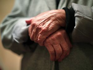 The hands of an elderly woman