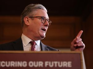 Sir Keir Starmer gesticulates as he delivers a speech