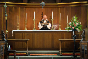 Rev. David Wright conducts the Eucharist service at St Peter's Church