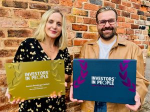 Rhia Oliver and Daniel Aston-Bell, from Access Bookings with their IIP award.