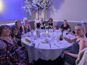 Nearly 100 women gathered at the Posh Frocks event in Telford to raise money to support older people across Shropshire.