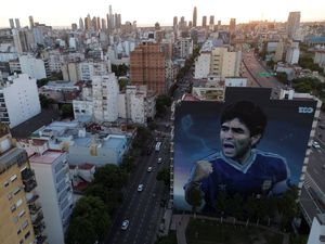 A large mural of the late football star Diego Maradona in Buenos Aires