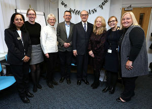 John with colleagues at his leaving do - he will leave officially on New Year's Eve