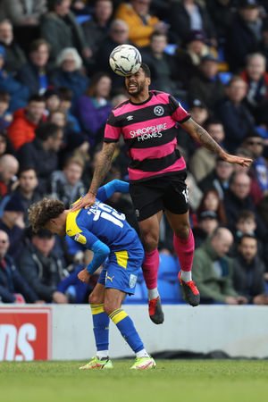 David Davis of Shrewsbury Town and Ayoub Assal of AFC Wimbledon (AMA)