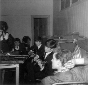 John and George strum away, watched by Roger and, foreground, Andre Wheeldon