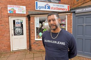 Waiting – Manni Massey outside his GM Stationery shop in Wombourne