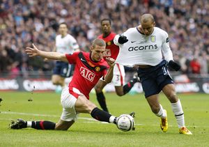 Aston Villa's Gabriel Agbonlahor (right) is fouled by Manchester United's Nemanja Vidic (left) in the penalty area.
