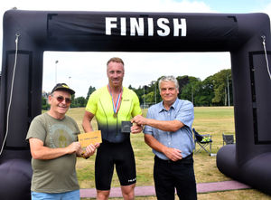 Winner in the Open 19-49 age category - Craig Rees with Liam Daly - President of Builth Wells Running Club and Builth Wells Deputy Mayor Councillor Alan Waller. Image by Ted Edwards Photography