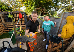 With the giant Halloween maze he built in his back garden, (left) Michael Marsden with friend Ryan Vickers, who will be helping to scare party guests on the night
