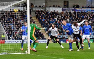 Albert Adomah heads Walsall level.