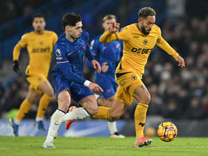 Matheus Cunha of Wolverhampton Wanderers is challenged by Pedro Neto of Chelsea  (Photo by Mike Hewitt/Getty Images)