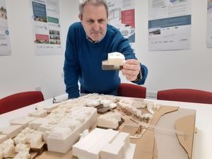 Councillor Ian Nellins with a piece of the town centre's proposed new jigsaw of proposed redevelopments