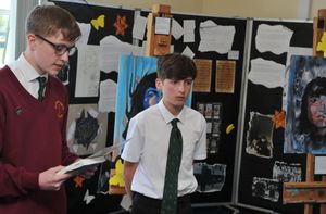 Students from The Priory School in Shrewsbury who have created an exhibition after learning about the holocaust thanks to a visit from writer Natalie Cumming who wrote the book The Fiddle.  Students at the front reading from The Fiddle to the guests