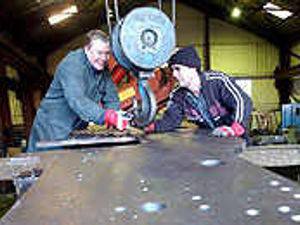 Supporting image for story: Railway workers on track to build engine