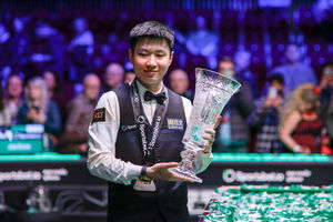 Zhao Xintong shows off his Players Championship title after bagging his latest silverware in Telford on Sunday night. Pic: WST