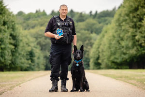 Pc Paul Hopley and West Midlands Police dog Stark (Penny Bird/Thin Blue Paw Awards/PA)
