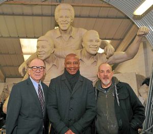 Businessman Jim Cadman, Albion star Cyrille Regis and sculptor Graham Ibbeson with the clay version