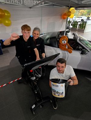 Staff members at Porsche Centre Wolverhampton have launched the first day of a three-day bike ride, all in aid of a dogs rescue charity. Pictures is apprentice technician Louis Daffurn, joint organisers Nicky Manotn and Mark Dyer, and Porsche mascot Turbo the dog.