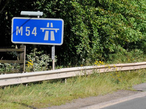 Supporting image for story: Car rolls onto embankment after tyre blow-out on M54