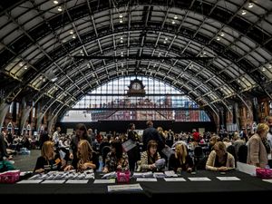 Election staff count ballot papers for the Greater Manchester mayoral election at the Manchester Central Convention Complex.