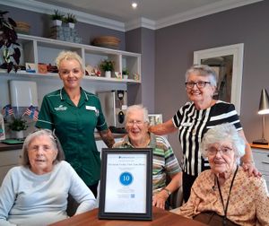 Wonderful Iverley residents Rita, Tony & Wilma, celebrate with care team Nikki and volunteer Ann