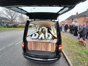 Many followed the horse-drawn carriage. There were tributes throughout the day for Gurdas Ram. The flowers on the coffin read 'Dad'.  Photo: Narinder Paul