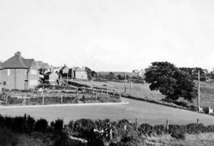 A view from 14 Avondale, Lawley Bank, in the 1950s, looking up Station Road towards the Bulls Head pub. This picture was shared by Mr Harry Bithell, born November 6, who was brought up at 14 Avondale. He lives now at 7 St Johns Drive, Trench, 01952 411332. Lawley Bank landscape, panorama, general view. Harry says the view has/had basically not changed but a lot of building work is going on now (off to the right). Library code: Lawley Bank nostalgia 2020.