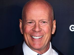 Supporting image for story: Bruce Willis cuddles puppy in first family photos since retirement due to health