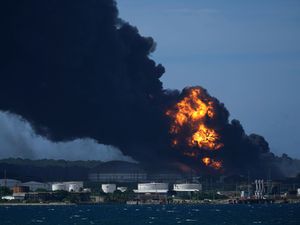 Supporting image for story: Seventeen missing and 121 hurt as fire rages in Cuban oil tank farm