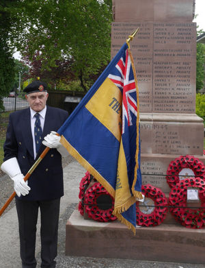 Standard bearer Carl Evans at the Presteigne war memorial