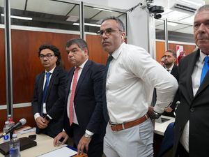 Neurologist Leopoldo Luque in court surrounded by others