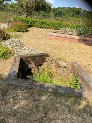 Drains in the garden adjacent to the lagoon site struggle to cope with frequent floods. Picture: Chris Naylor