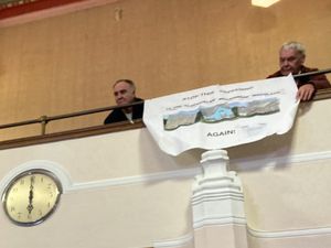 Protestors against planned homes on a site in Brierley Hill brought a banner to Dudley Council\'s planning meeting. 