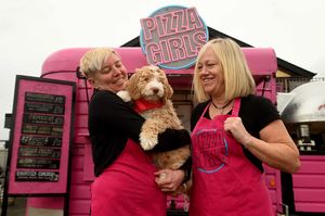 Angela Twigg and Sara Thomas with mascot  Yumi 