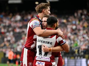 Wigan celebrate a try against Warrington in Las Vegas