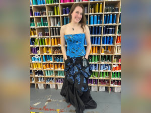 Supporting image for story: 'Who knew old workwear could be used so creatively?' Fashion student creates glam dress from recycled uniforms