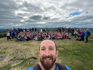 Smile! Headteacher of Pontesbury Primary School Tom Lowrie-Herz takes a selfie with school pupils and staff at the top of Earl's and Pontesford Hill