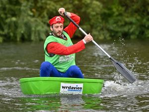 Supporting image for story: 29 pictures of boats capsizing and wacky racing as Super Mario, pirates and octopuses take part in Shrewsbury's Coracle World Championships