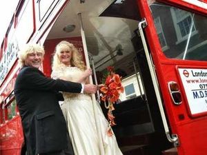Supporting image for story: Double-decker fun as newlyweds hitch a lift