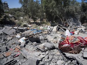 Supporting image for story: Six children among 10 people killed at water collection point by Israeli strike