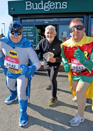 'Batman and Robin' with Budgens manager Bobby Bhandal who is donating £500