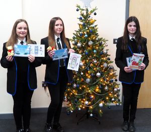 Card design competition winners from Burton Borough School, from left, Sofia Buckless, Hollie Roberts Gray, and Ivy Wrighton.