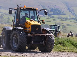Mervyn Price in his JCB Fastrax leading the procession