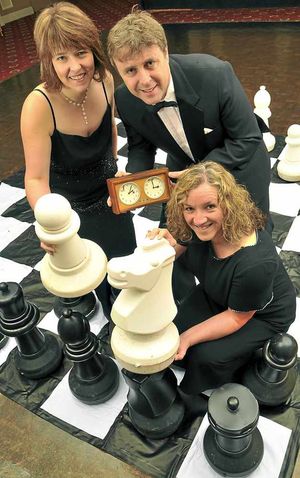 Nicky Lloyd, front, gives a few chess tips to key show characters Florence, played by Liz Law, and Anatoly, played by Kevin Sudlow