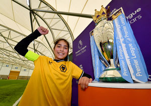 Avaani Hayer gets the chance to pose with the Premier League trophy