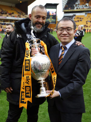 Nuno Espirito Santo manager / head coach of Wolverhampton Wanderers and chairman Jeff Shi celebrate with the EFL Sky Bet Championship trophy.